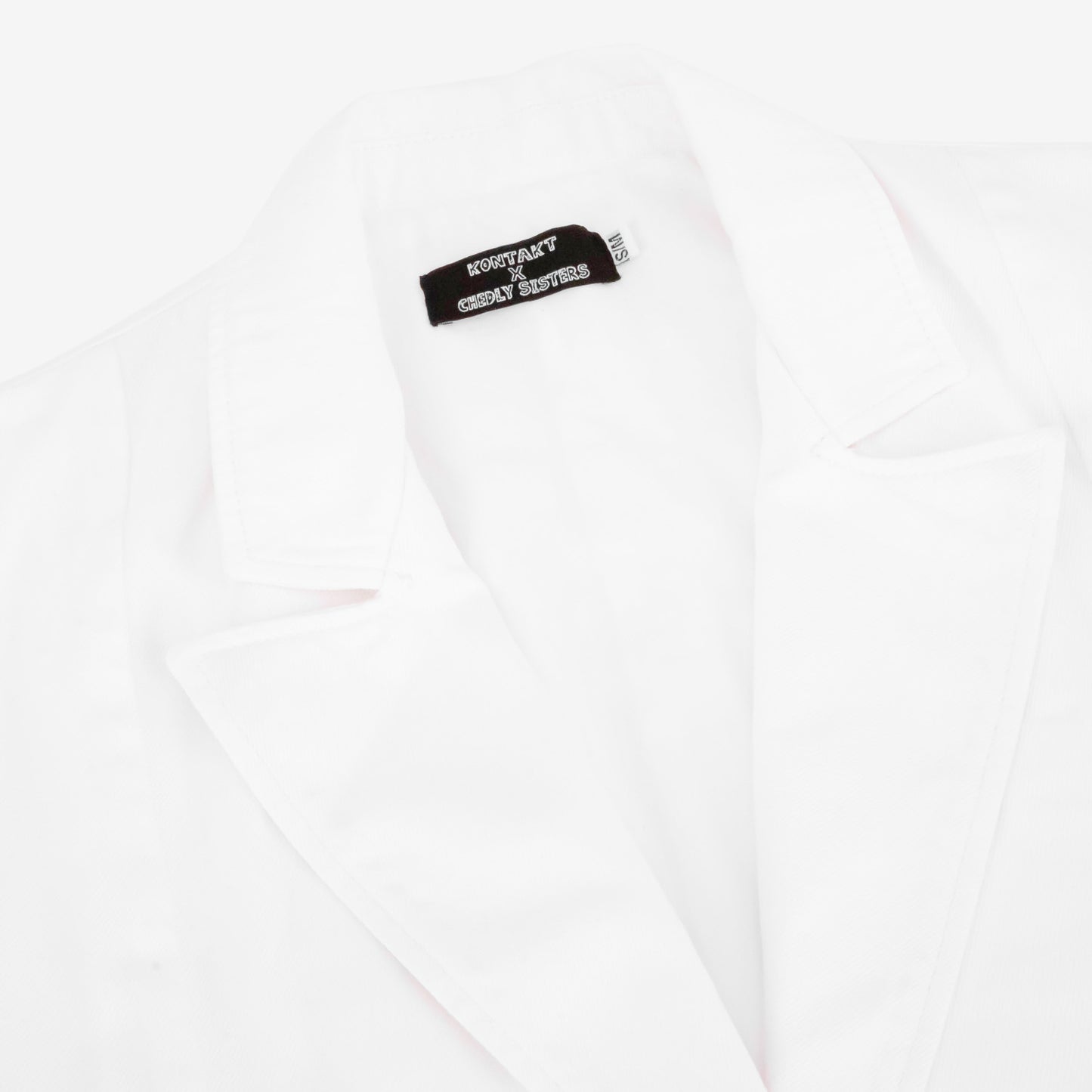 CS X Kontakt Sleeveless Crossover Blazer
